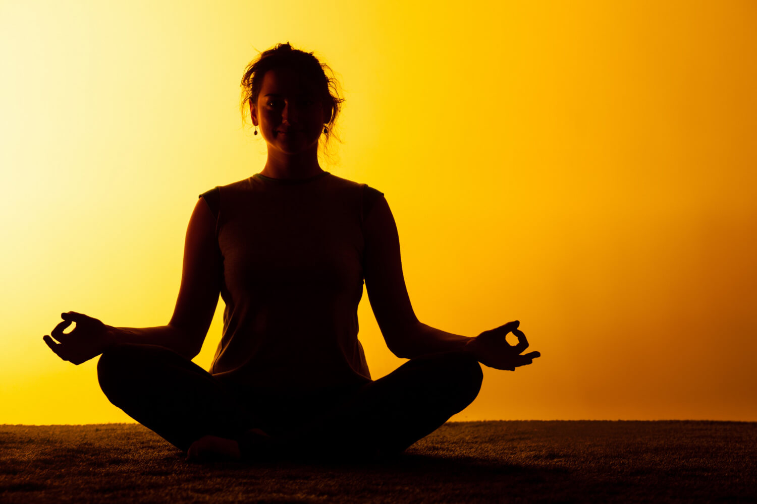 woman practicing yoga sunset light 1